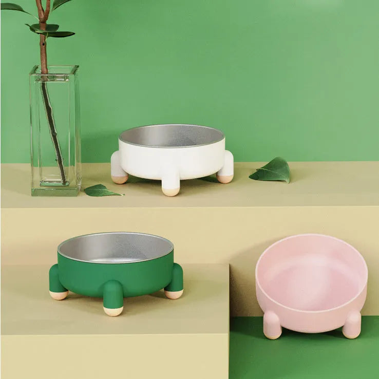 Green stainless steel pet bowl with a non-slip base and raised high foot for dogs and cats.
