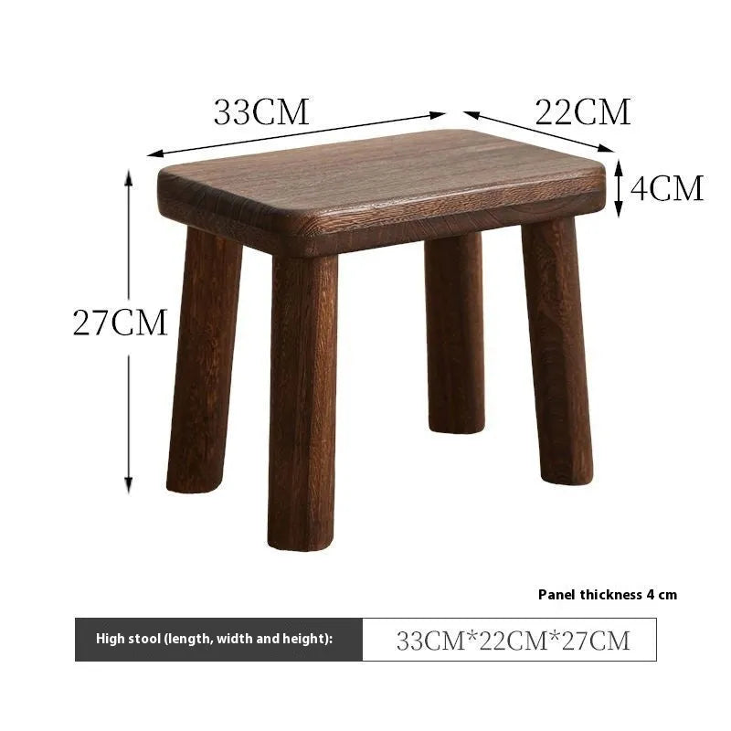 Solid wood shoes changing stool with distressed finish and bracket leg structure.