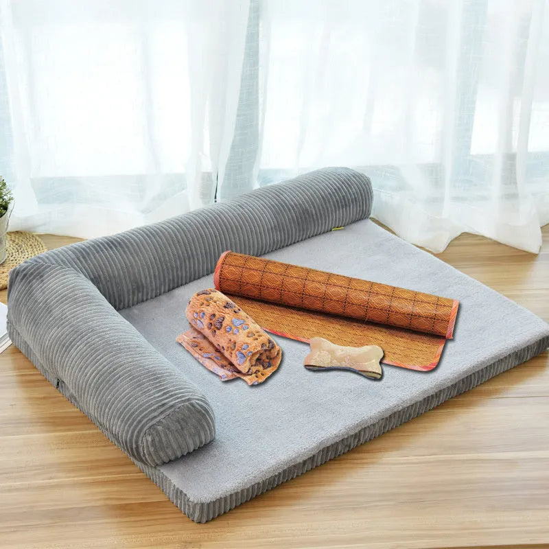 Corduroy dog bed sofa with bolster sides and non-slip base in a neutral colour.