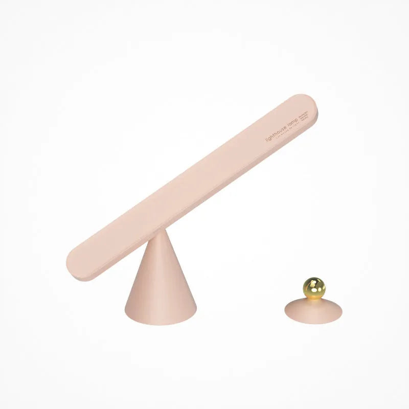Geometric wireless table lamp with magnetic base in white colour showing touch controls