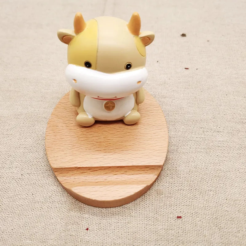 Resin mobile phone holder with beech wood animal design and coin storage compartment