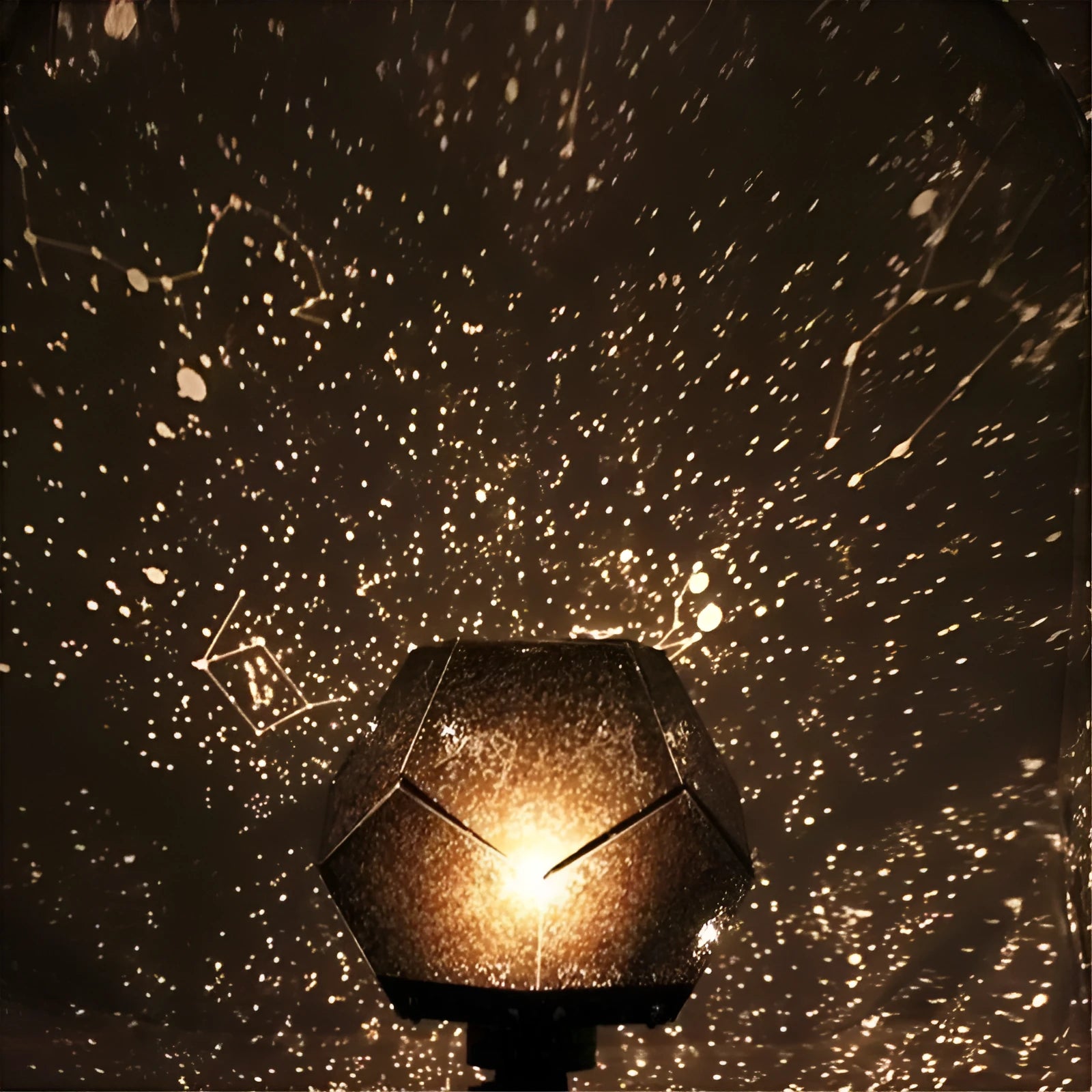 LED star projector night light showing constellation projection on a bedroom ceiling