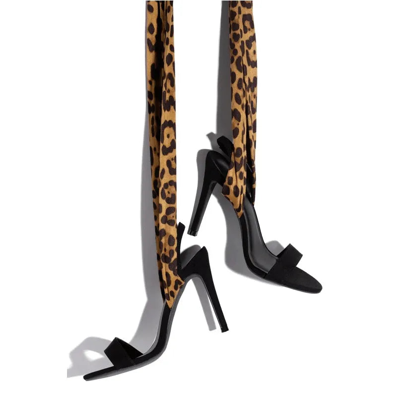 Light brown leopard print Roman style high heels with cross strap and thin 8cm heel.
