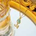Gold electroplated tulip flower pendant on an adjustable titanium steel necklace chain.