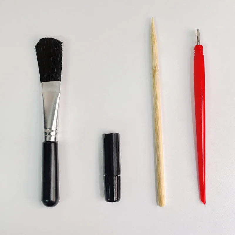 Scraping painting tools kit with white card paper, scraping pens, brushes, and art accessories for scratch artwork