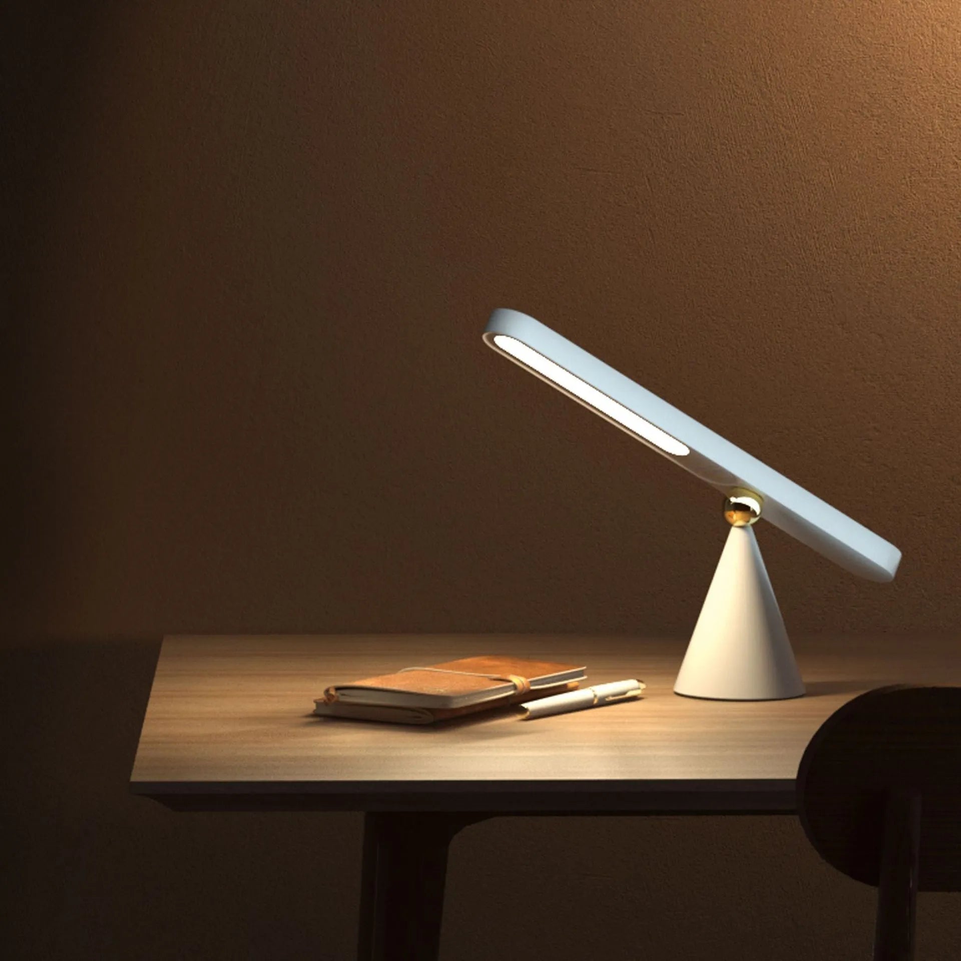 Geometric wireless table lamp with magnetic base in white colour showing touch controls
