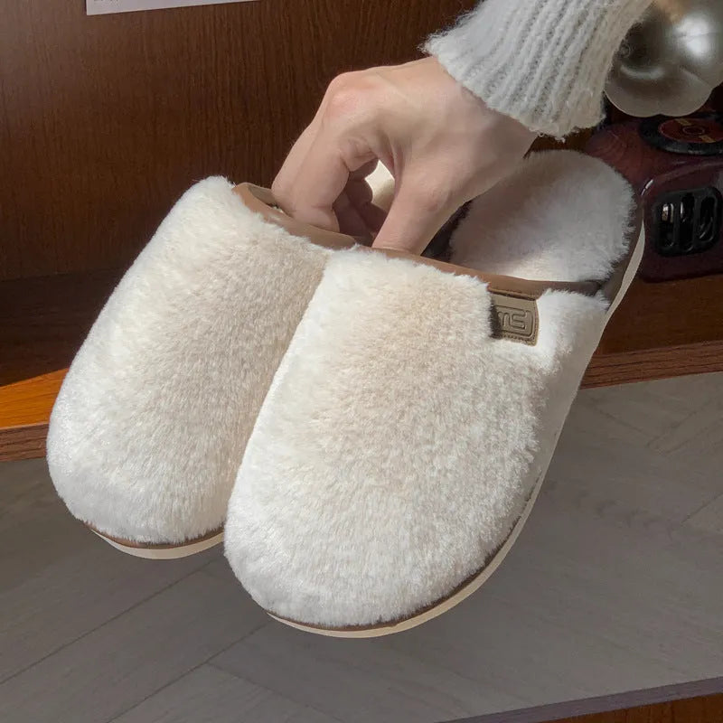 PVC non-slip winter slipper in a solid colour on a wooden floor.