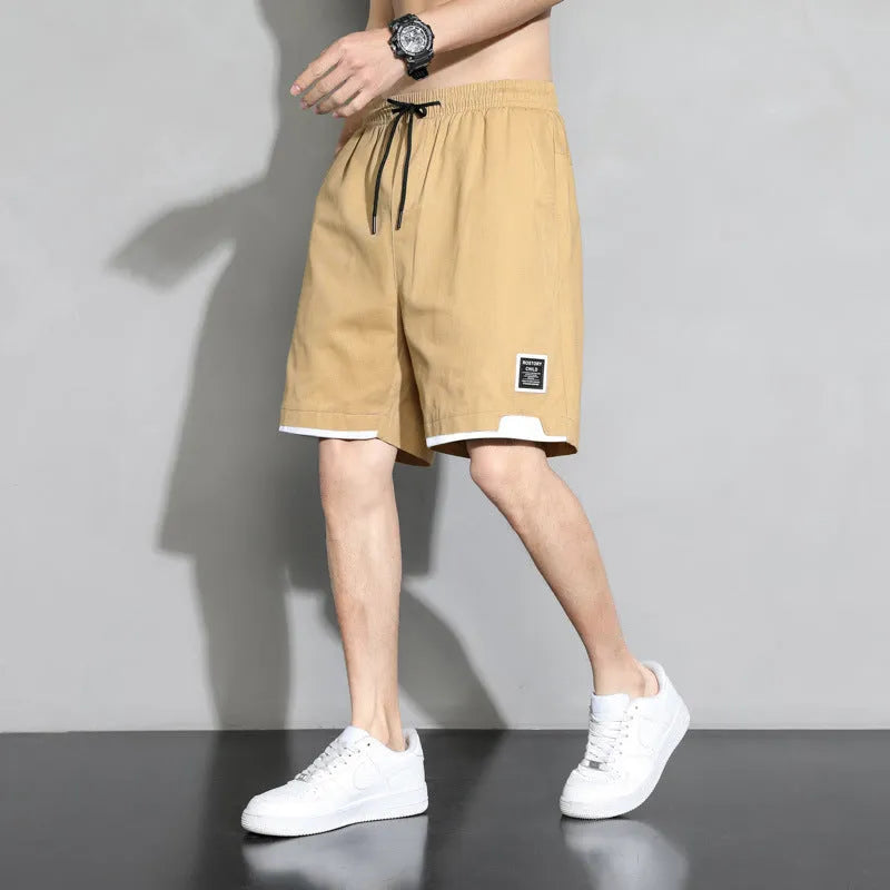 Boys' cotton summer shorts in sporty style available in black, khaki, and white colours