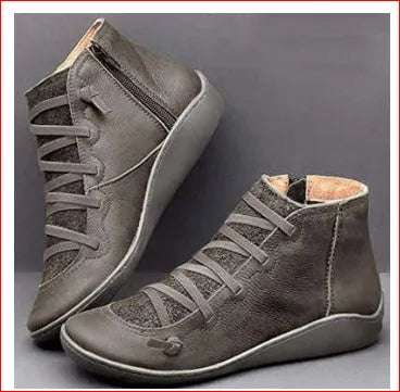 Women's flat casual booties with wedge heel and round toe in multiple colour options.