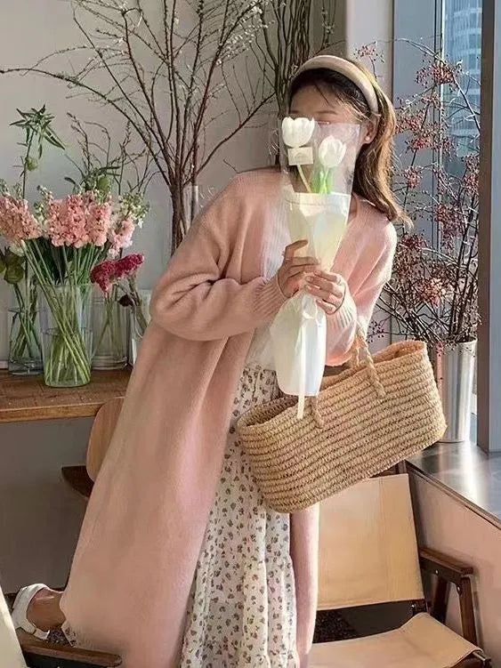 Women's loose fit knitted cardigan in khaki with V-neck and long sleeves.