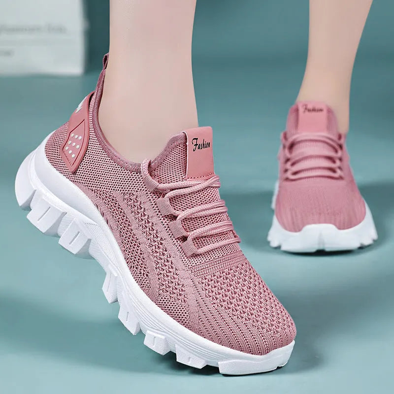Women's white Flyknit sneaker with thick PVC sole and round toe lace-up design