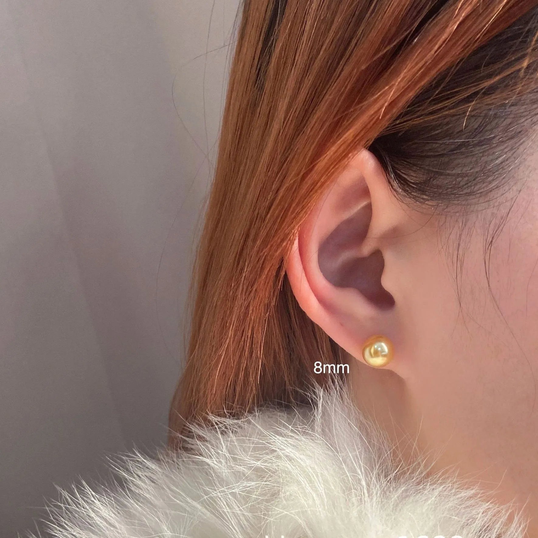A pair of large geometric pearl stud earrings for women in silver, showing an eight-point star design detail.