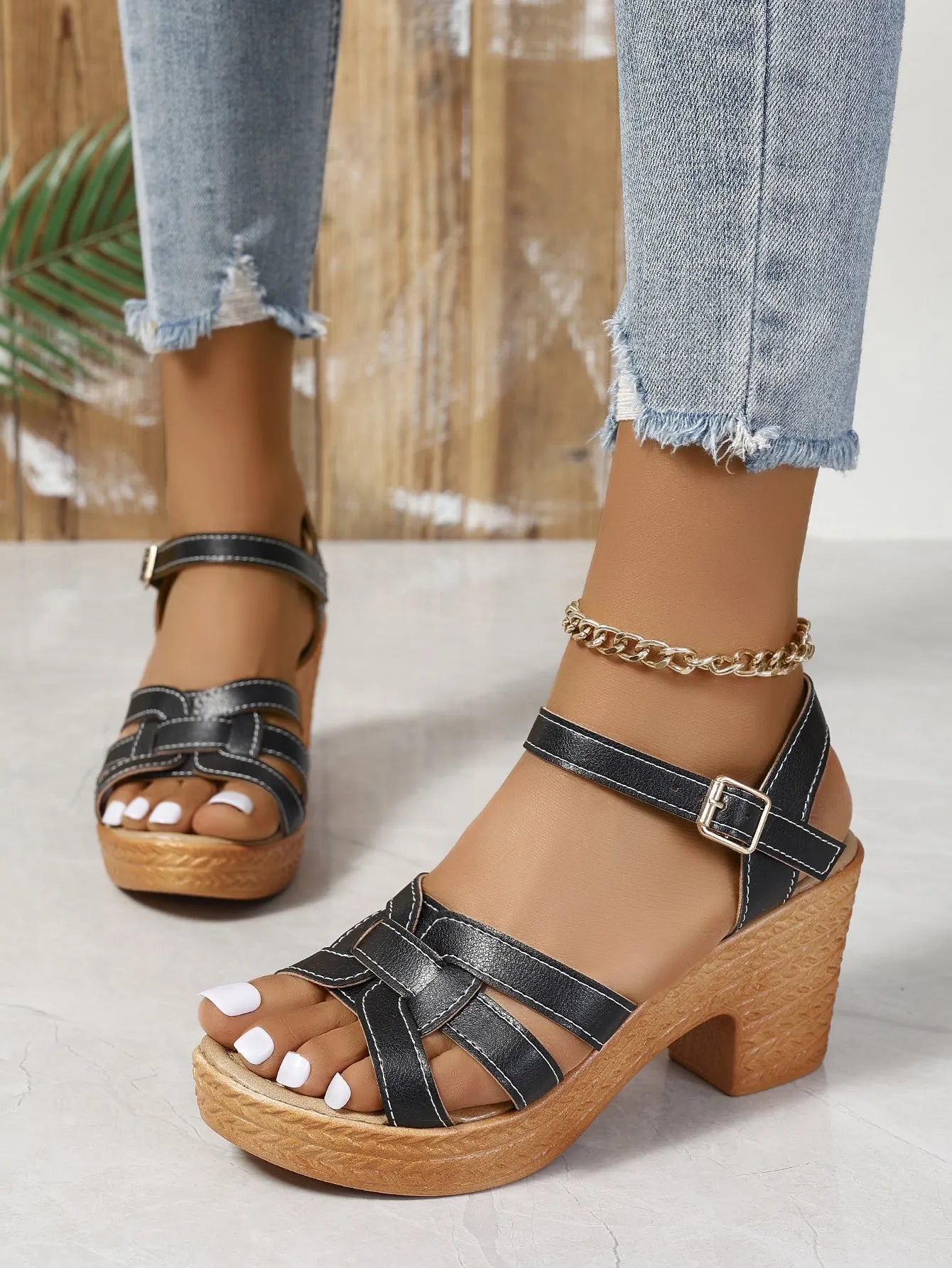 Plus size Roman women's peep toe chunky heel buckle sandals in black on white background