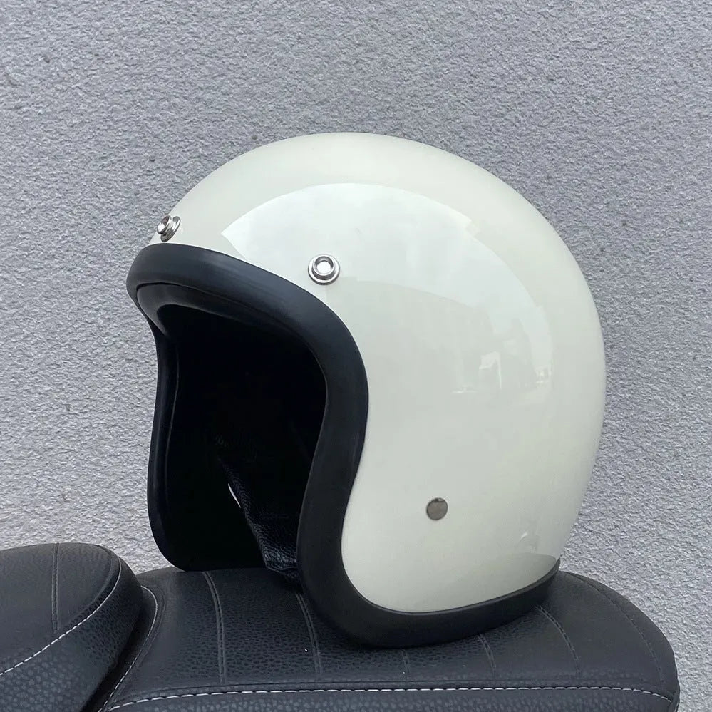 Glass fibre retro half motorcycle helmet shown in multiple colour options including cement grey and matte black flower patterns