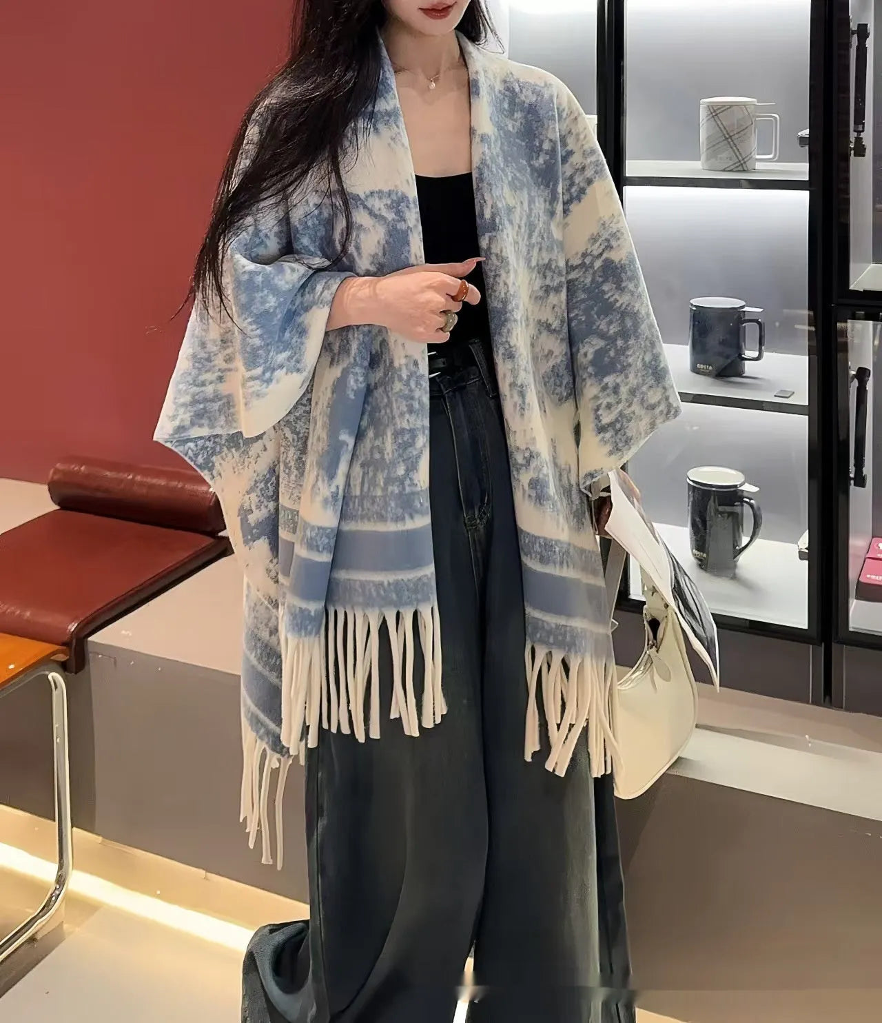 Women's polyester scarf cape with tassel edges worn as shawl in casual style