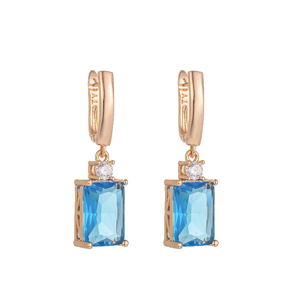 Square geometric copper earrings with gold or silver electroplated finish showing quadrilateral shape.