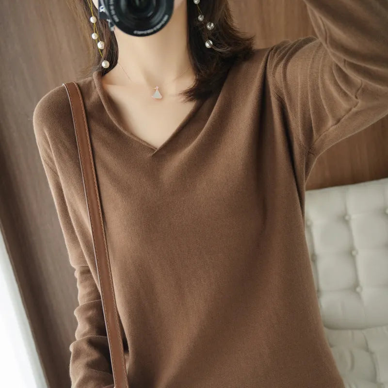 Women's long sleeve V-neck knitwear pullover top in a choice of ten colours on a hanger.