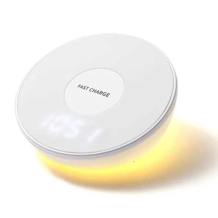White wireless phone charger with digital clock display showing time, measuring 115mm long