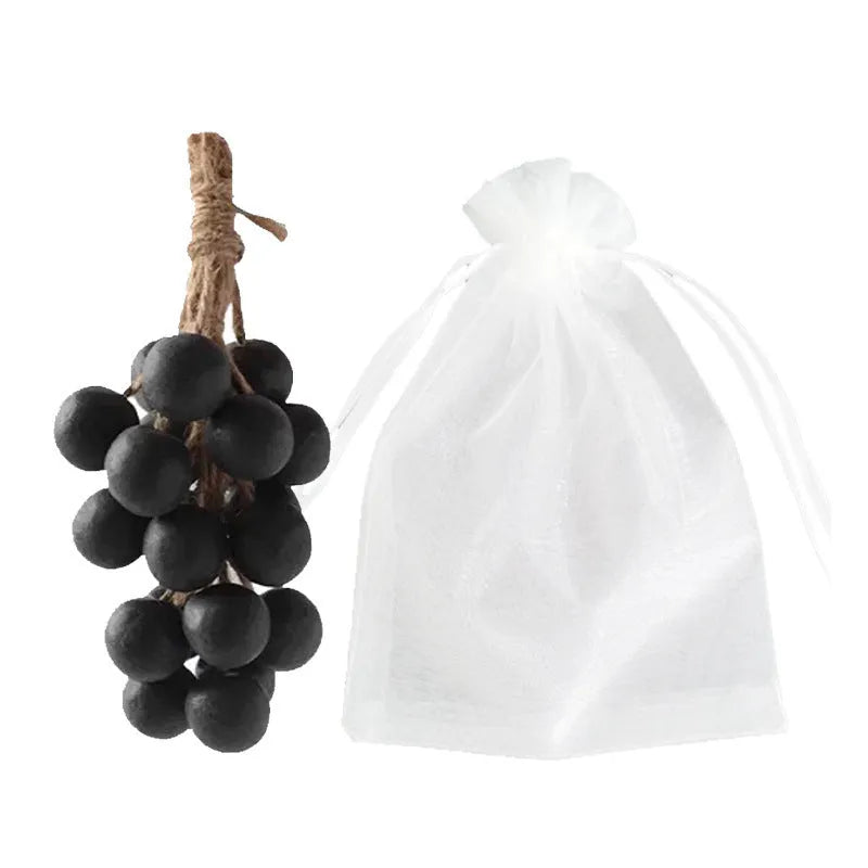 Handmade grape soap bars in black, green, and purple grape scents alongside litchi soap, with gift box and mesh bag packaging