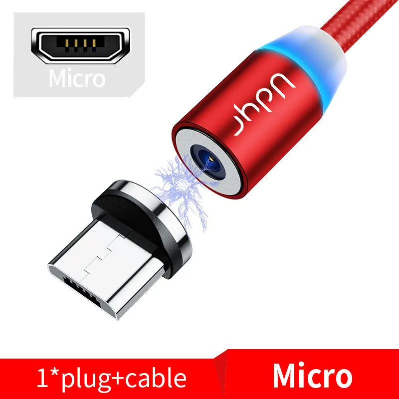 Black magnetic data cable with detachable USB-C and Lightning heads on a table.