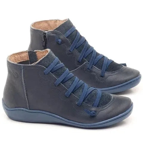 Women's flat casual booties with wedge heel and round toe in multiple colour options.