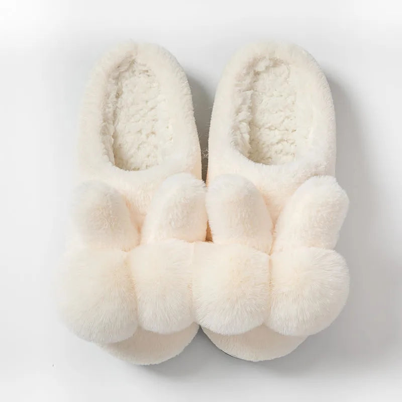 Women's fluffy bunny slippers in pink with rabbit fur, high-top sleeve design, and sewn sole.