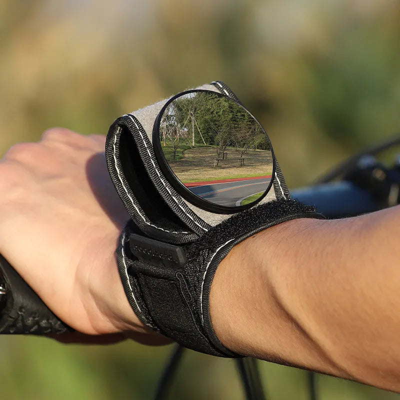 Black nylon rear-view mirror for bicycle handlebars, showing the 6 cm circular glass.