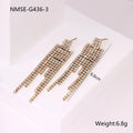 Gold plated stainless steel earrings with love heart and star geometric shapes and diamond tassel details