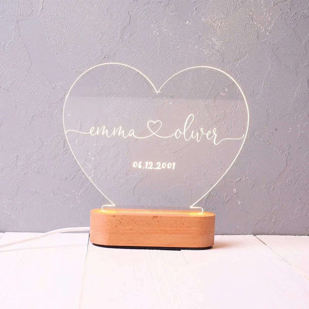 Custom transparent acrylic night light with LED base showing personalised engraving, dimensions 20cm by 11.5cm.