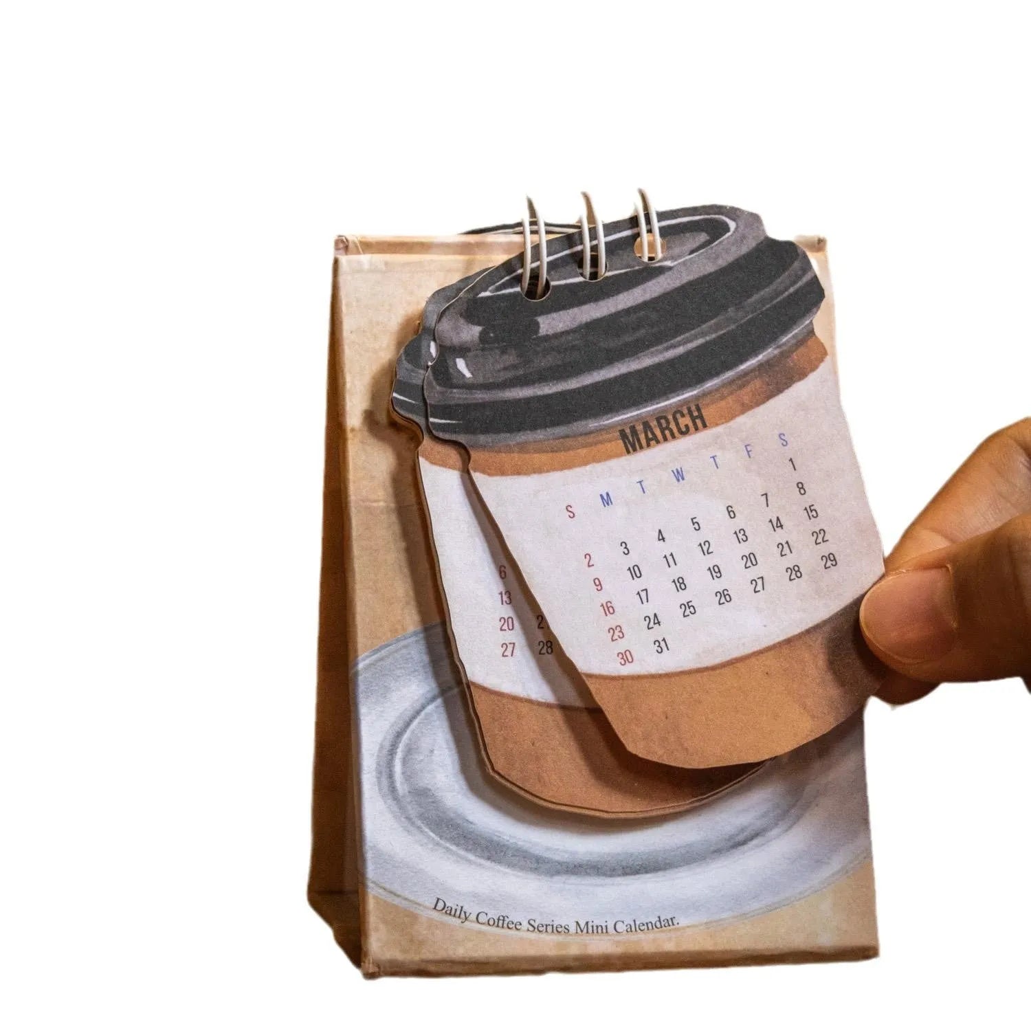 Mini coffee-themed desk calendar for 2025 showing daily pages and simple modern design