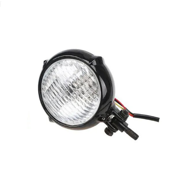 Black aluminium Harley retro headlight with 8cm diameter and yellow halogen bulb