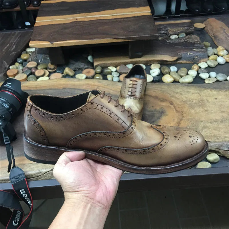 Light brown men's vintage distressed leather shoes with engraved detailing and lace-up closure