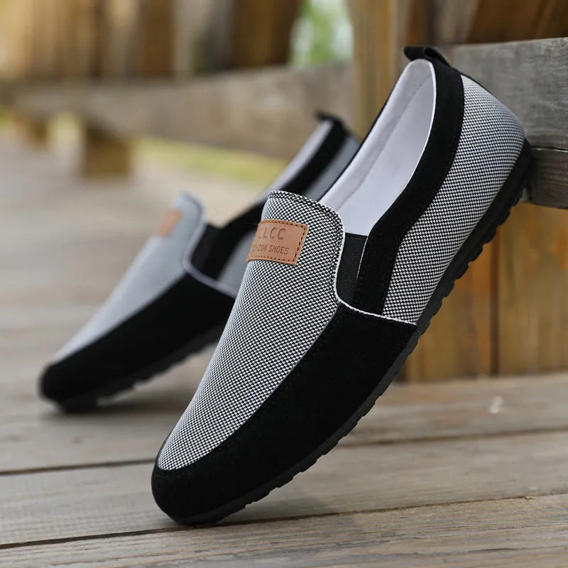 Men's grey and khaki canvas casual shoes with a round toe and rubber sole.
