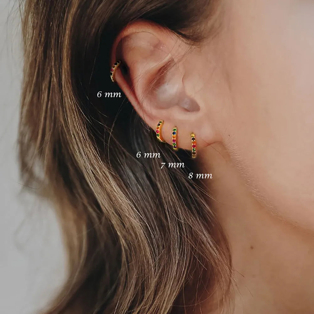 Circle perforated zircon stud earrings in gold, rose gold, and silver colour with geometric design