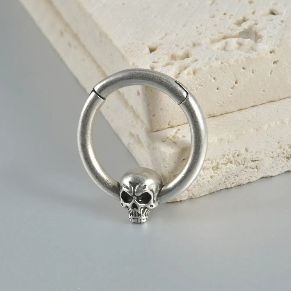 Copper punk earrings with ghost head design in antique silver or ancient gold colour