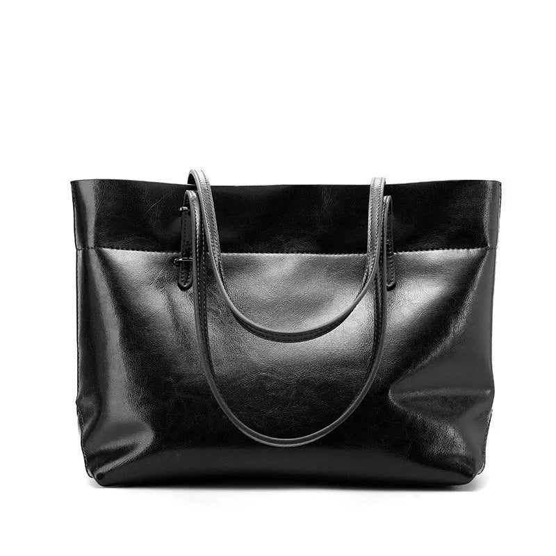 Cowhide leather cross-body handbag showing internal compartments and mobile phone pocket