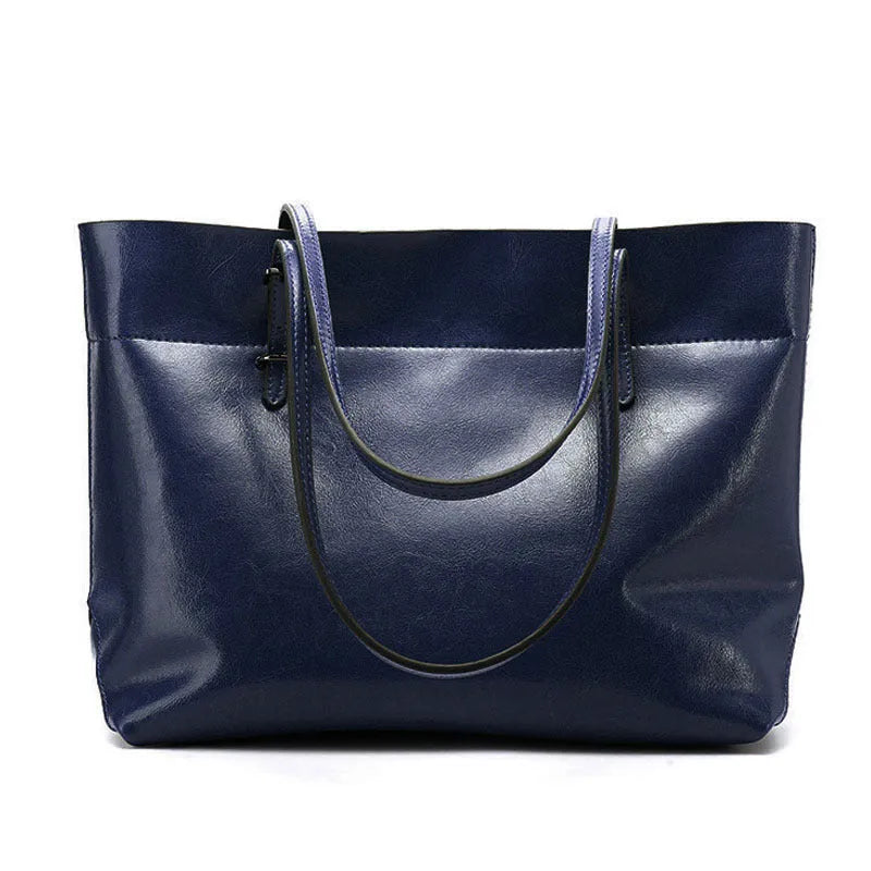 Cowhide leather cross-body handbag showing internal compartments and mobile phone pocket