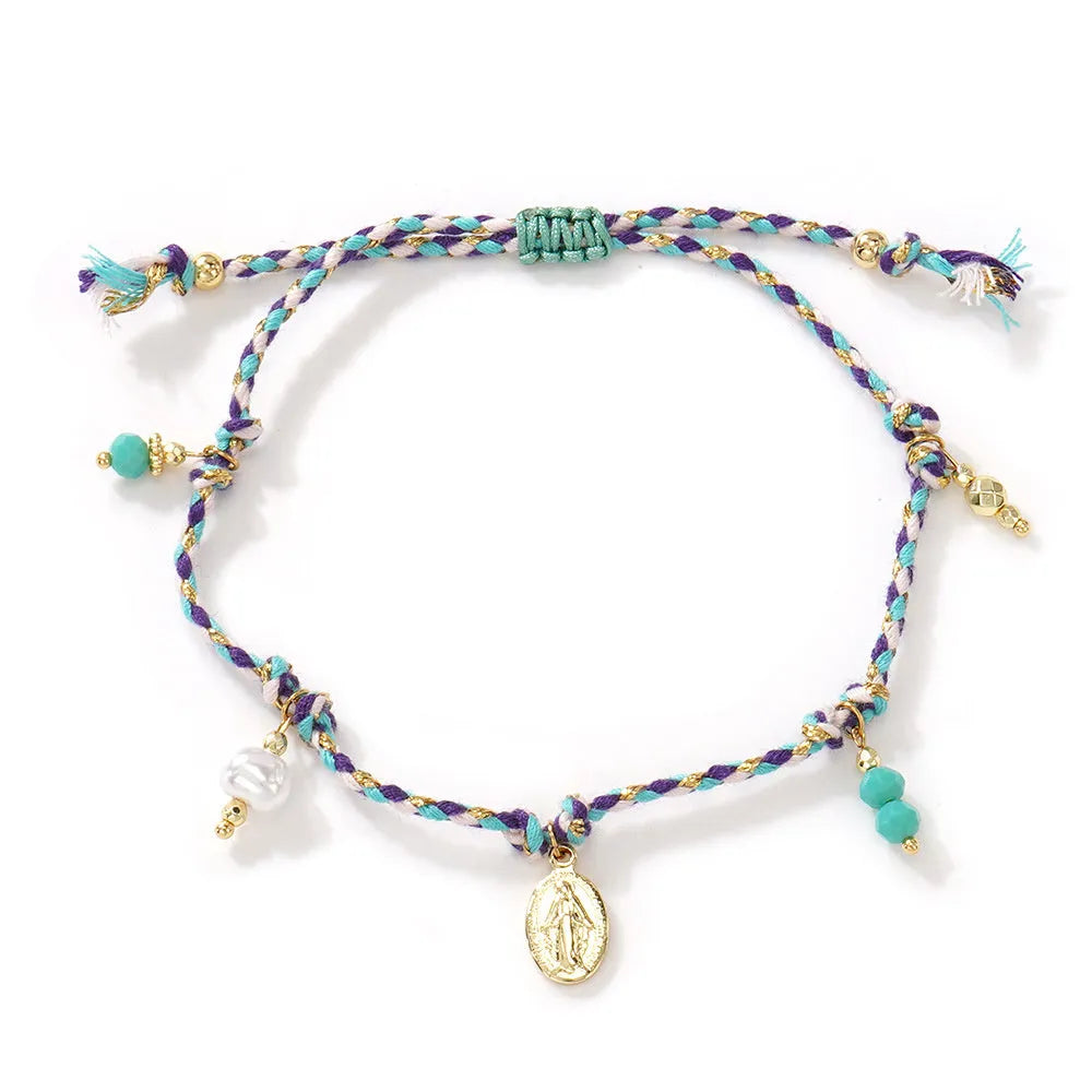 Close-up of a hand-woven colourful braided rope bracelet with an adjustable strap tag closure.
