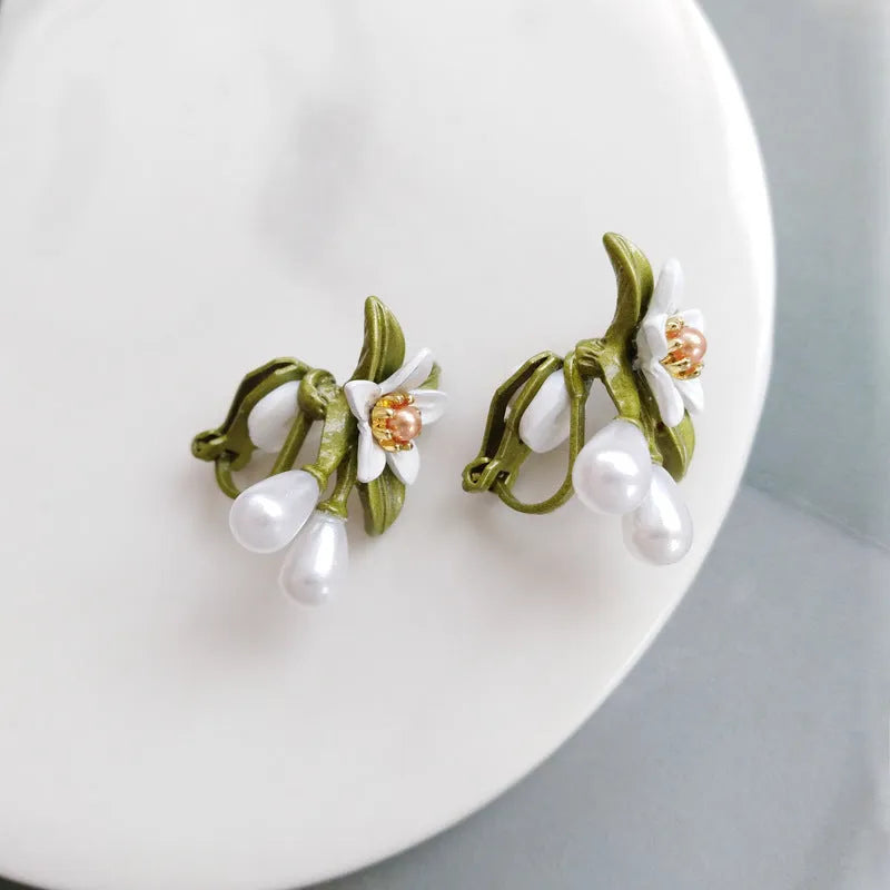 Women's alloy flower earrings with sterling silver needle design and clip-on alternative