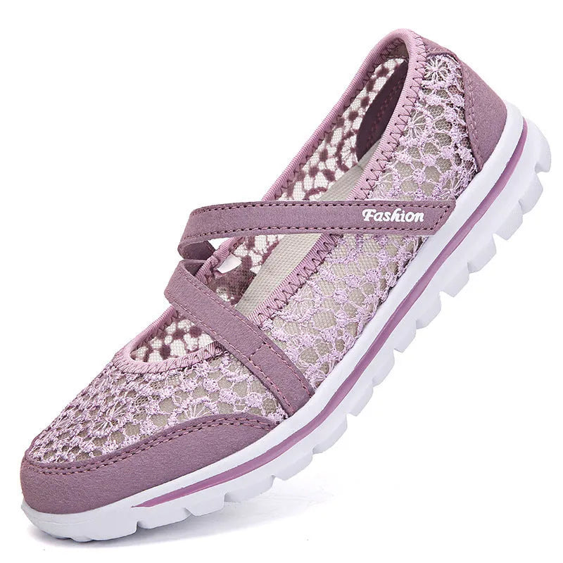 Women's flat casual shoes in beige with mesh upper and round toe, shown from the side.