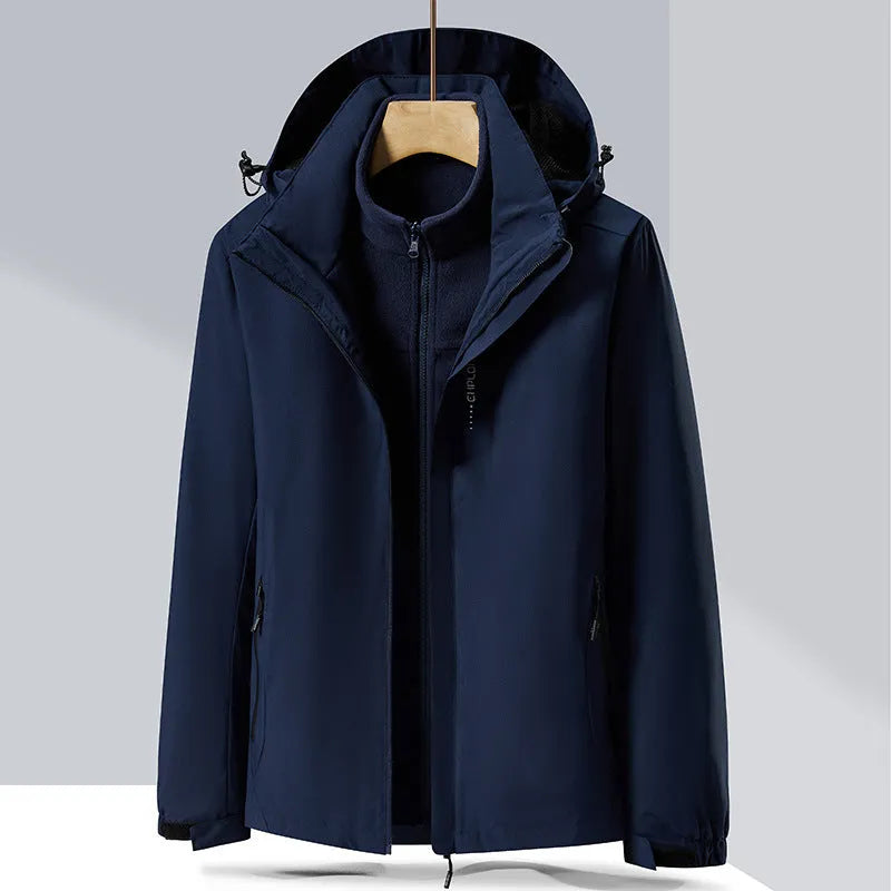 Men's black waterproof mountaineering jacket and trousers set with removable fleece lining.