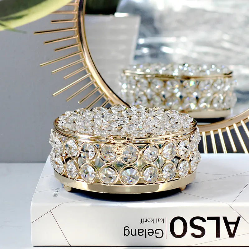 French gold metal jewellery box with a transparent crystal glass lid for storing rings and necklaces.