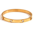 Women's stainless steel bracelet with micro-inlaid peach heart charm in golden electroplated finish