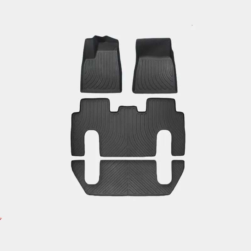 Tesla Model X black TPE rubber floor mats and boot liner set on car interior.
