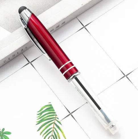 Red multifunctional metal-tipped stylus ballpoint pen with a built-in LED light.