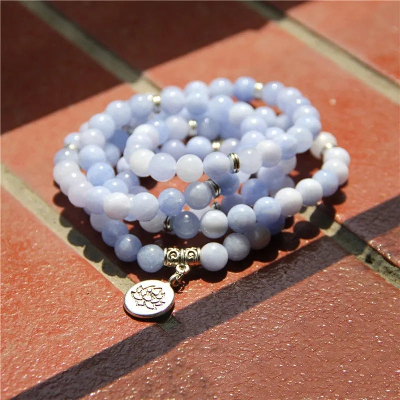 Women's vintage-style bracelet with a natural stone angel echeveria lotus pendant on a chain.