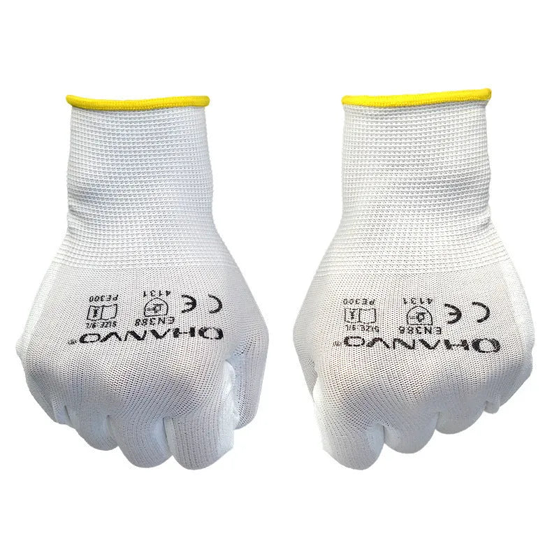 White PU coated labour gloves showing textured palm grip, medium and large sizes on a workbench.