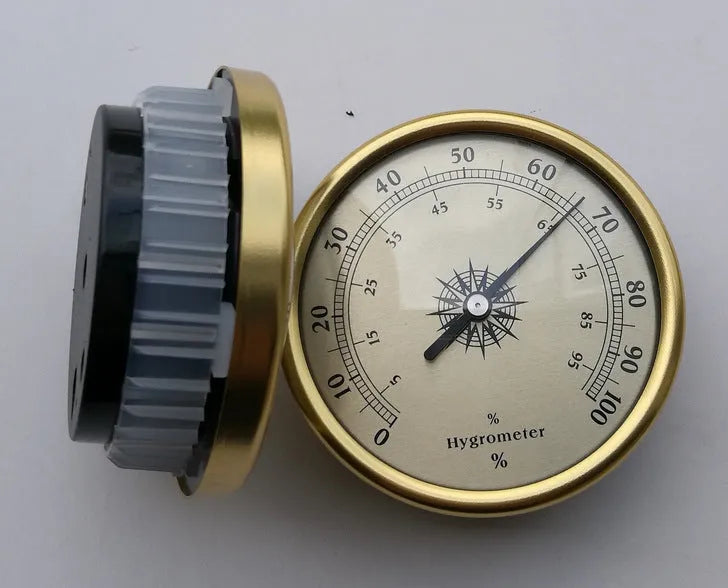 Circular aluminium analogue thermometer and hygrometer showing temperature and humidity dials