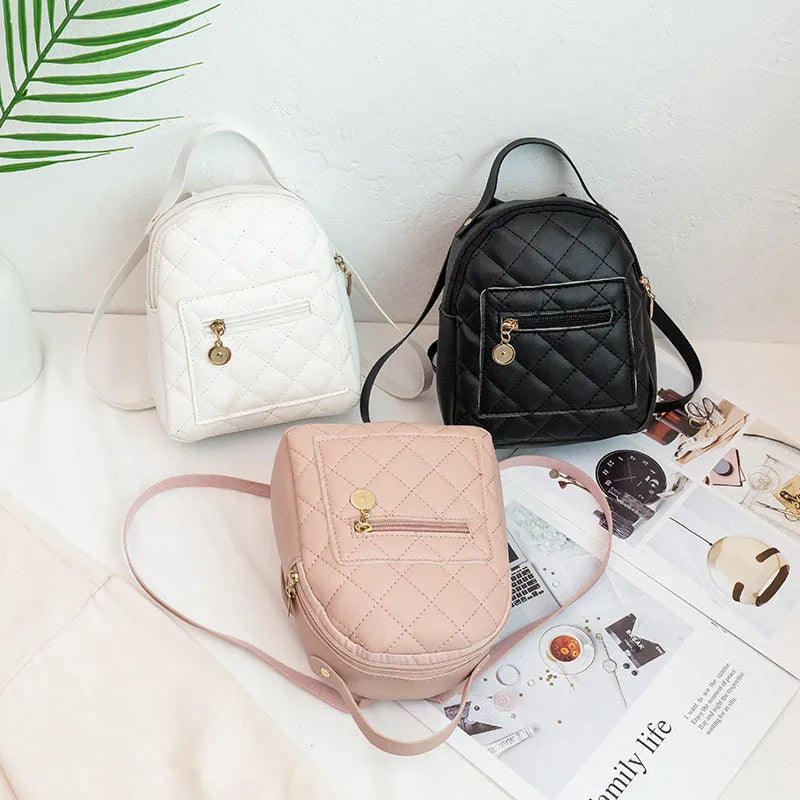 Girls' Korean style embroidered backpack in hard PU material showing vertical square shape and sandwich pocket