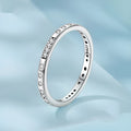 Women's oxidised black silver 'I Love You' ring with moss password design on a hand.